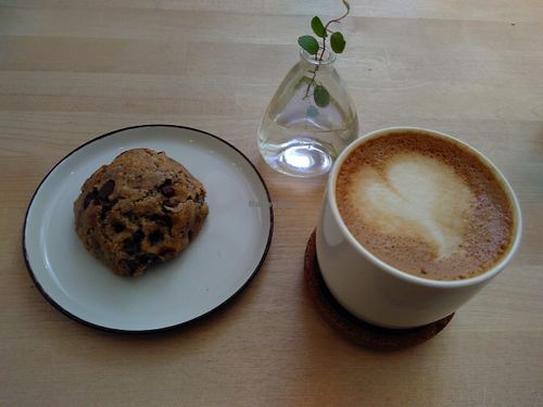Cranberry chocolatechip cookie and oatmilk cappuchino. at El Fant in Helsinki