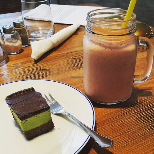 My favorites "Strawberry bee" smoothie and an amazing raw dessert "After eight" chocolate mint bite at Gioia Plant-Based Cuisine in Marbella