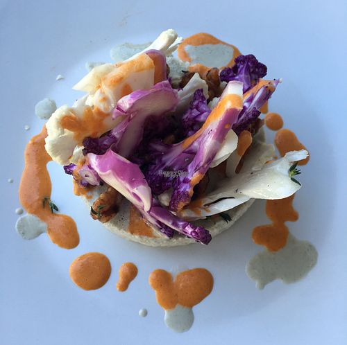 Raw cauliflower couscous, candied walnuts, Harissa sauce at Gioia Plant-Based Cuisine in Marbella