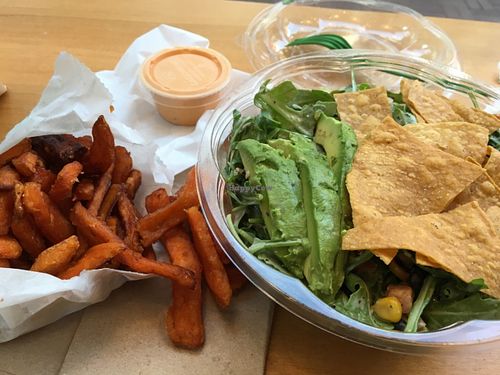 Sweet potato fries and arugula taco salad at HipCityVeg - 7th St in Washington