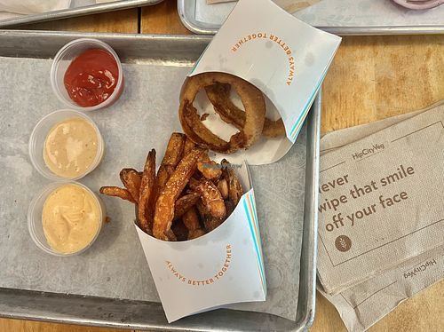 Perfect vegan fast food experience!  Onion rings, fries, and lots of dips.  at HipCityVeg - 7th St in Washington