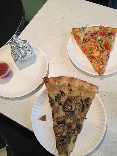 Pizza slices and dough balls wrapped to go (mushroom one was amazing!) at Screamer's Pizzeria - Greenpoint in Brooklyn