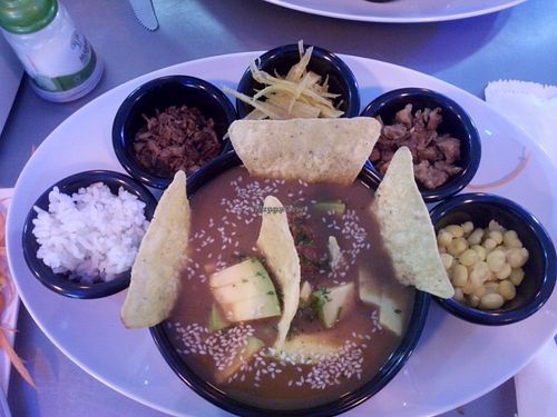Bandeja de frijoles con aguacate, ajonjolí y nachos

arroz, carne molida vegetal, platanitos, chicharrón vegetal, maicitos.  at Los Robots in Medellin