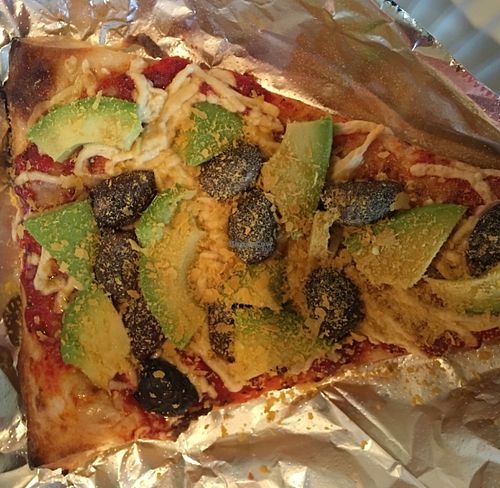 Avocado and kalamata olive slice And nutritional yeast at Oasis Cafe in Portland