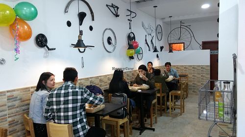 FULL HOUSE with bikes in the walls. at Lu Cocina Vegana in Bogota