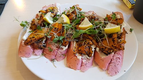 Carrot-salmon toasts at Terapija in Riga