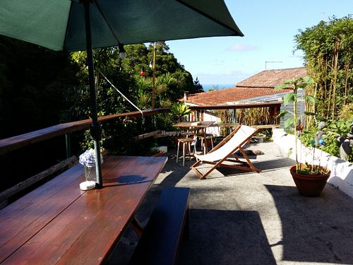Outdoor seating at O Esconderijo in Faial