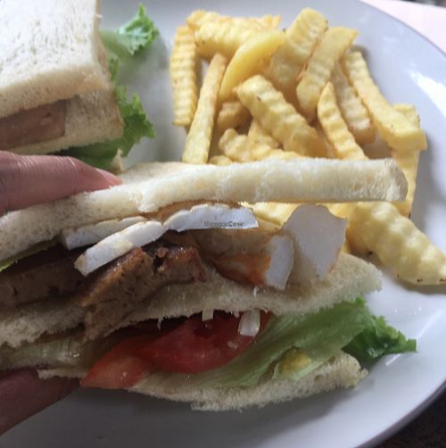 club sandwich! with mock pork, prawns, and squid.  at Bali Maitreya Cafe in Lembongan