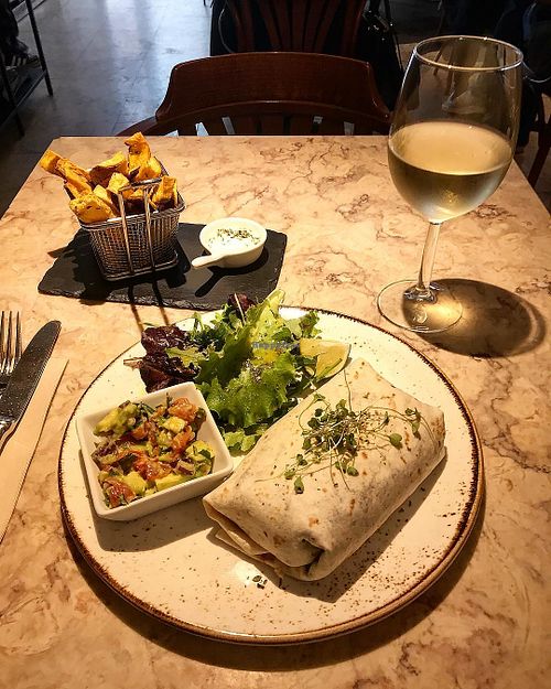 Daily menu: black bean burrito with brown rice and cilantro, guacamole and green salad + sweet potato chips. at 26 Vegan Food Project in Lisbon