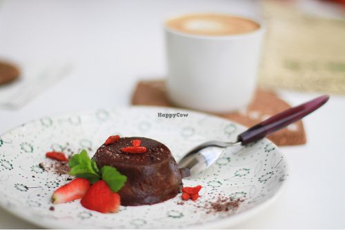 Capuccino with almond milk and tasty raw dessert  at Groot in Moscow