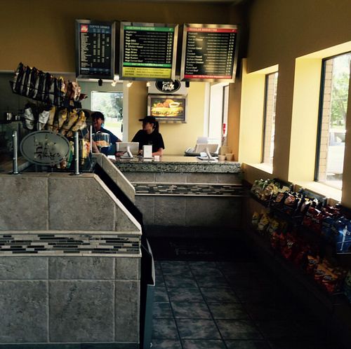 cashier and menu at Baguette de France in Berrien Springs