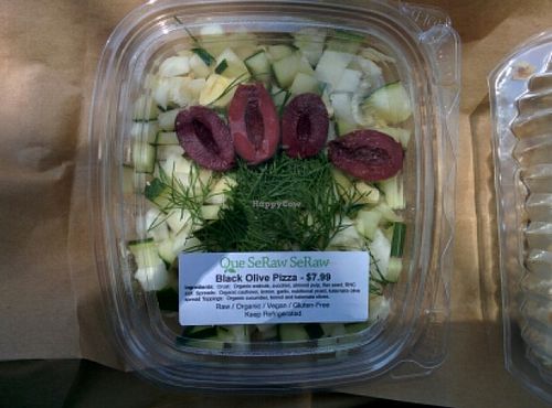 black olive pizza: cucumber,kalamata olives,fennel with crust made of walnuts,zuchinni and almond pulp at Que SeRaw SeRaw in Burlingame