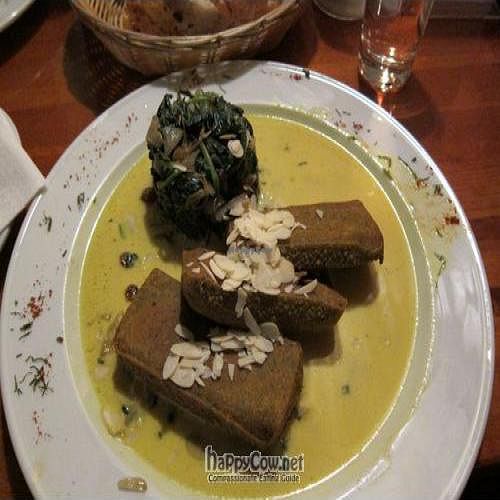 chickpea polenta in curry sauce with spinach,almonds and raisins at Cafe V in Berlin