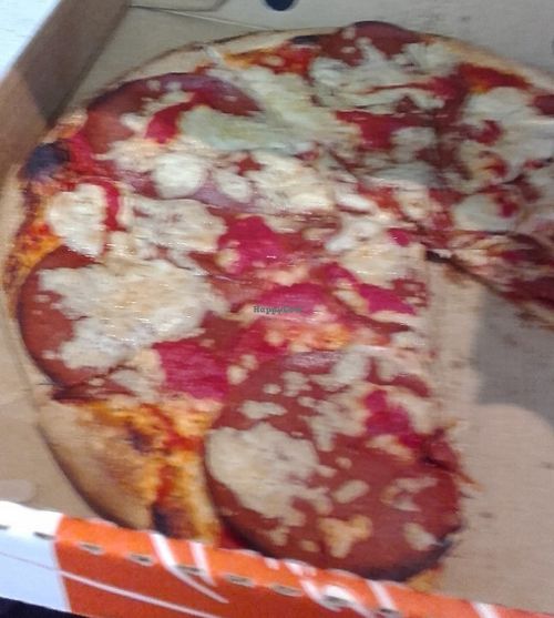 American pizza - vegan version - tomato sauce, mozzarella and vegan salami at Eat Pizza - Flinders St in Melbourne