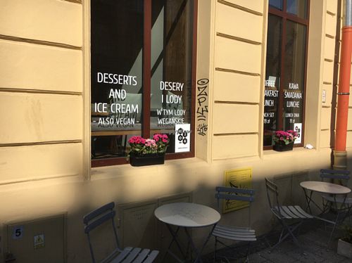 Windows with vegan signs  at Mo-Ja Cafe in Krakow