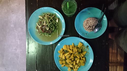 Morning glory with mushrooms, pumpkin in mild curry, brown rice, spirulina-banana shake at Bodhi Tree Cafe in Chiang Mai