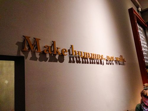 Sign inside Hummus & Friends at Hummus & Friends in Berlin