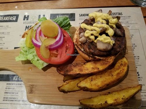 Yummy Vegan burger with potato wedges  at Holi Vegan Kitchen in North Miami Beach