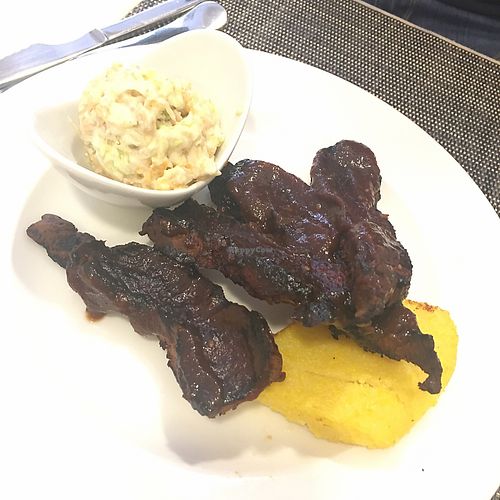 costillitas de seitan con polenta y salsa de col. Super crujientes!  at Camino Vegano in Logrono