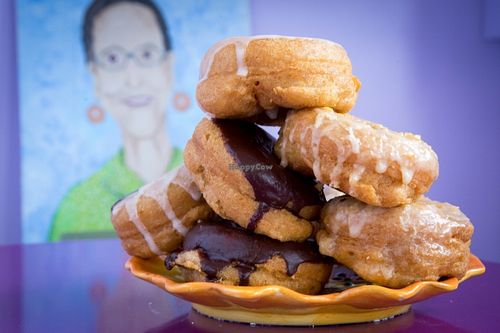 sample of donuts with Nana in the background at Nana's Donuts in Charleston