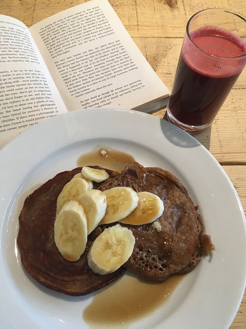 Pancakes with banana and syrup. at Green Kitchen in Brighton