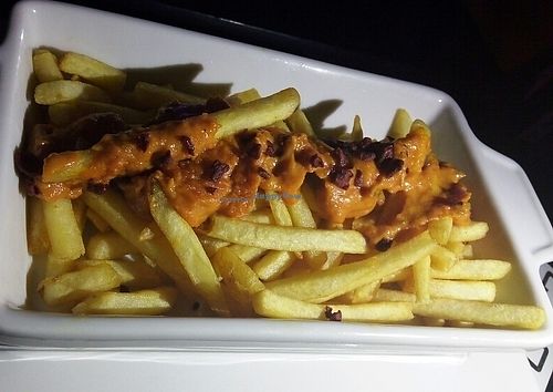 fries topped with vegan cheese at Mooo in Recife