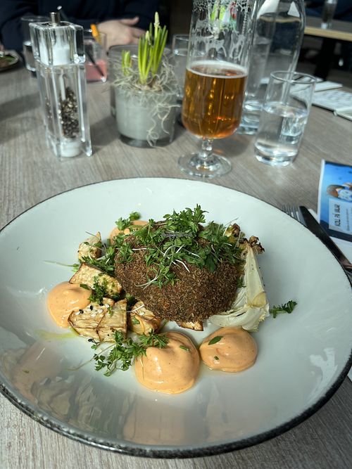 Green pea steaks served with braised pointed cabbage with yuzu and sesame, salt-baked celeriac, spring onions and chili emulsion – 199 SEK  at Torekov Hotel Bistro in Torekov