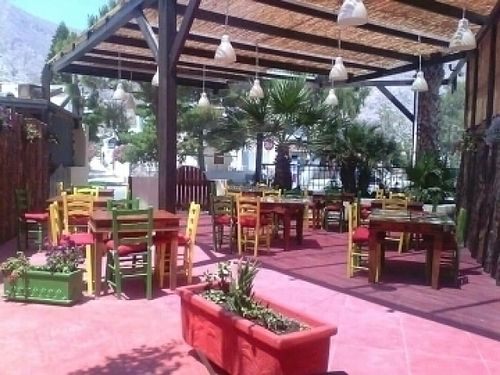 outdoor seating area at Gecko Burger Place in Santorini