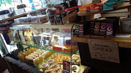Fridge with cakes at Caffi Pura in Tenby
