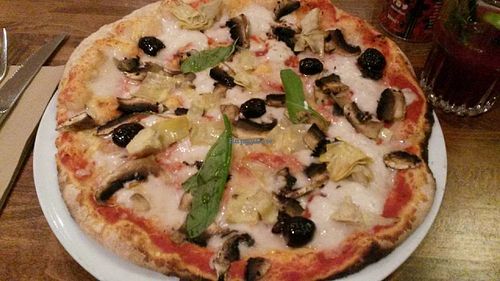 Classic margarita pizza with olives, artichokes and mushroom topping at Zizzi in Newcastle Upon Tyne