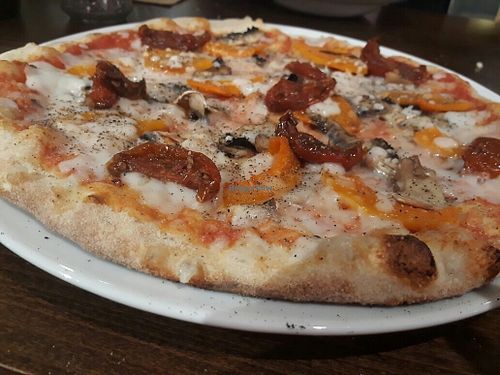 Dairy free vegan pizza with artichokes, balsamic tomatoes and butternut squash at Zizzi in Chislehurst