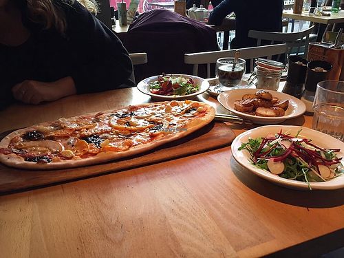 Vegan rustica pizza with butternut squash, Caramelised balsamic onions, mushrooms, garlic cloves and pine nuts  at Zizzi in Watford