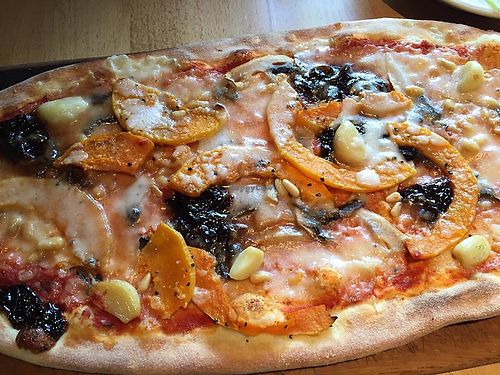Vegan rustica pizza with butternut squash, Caramelised balsamic onions, mushrooms, garlic cloves and pine nuts  at Zizzi in Watford