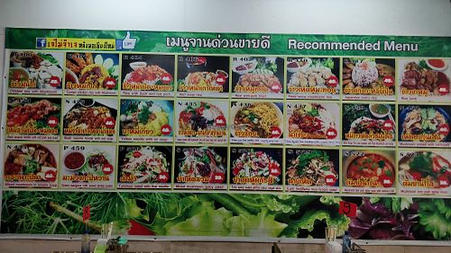 Recommended menu items are on the wall at Jai Mai Jumjay in Chiang Mai