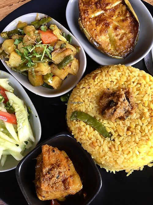 Kitchuri platter with fried eggplant, potatoes, mango pickle and a cucumber salad for 450 BDT. at Jatra Biroti in Dhaka