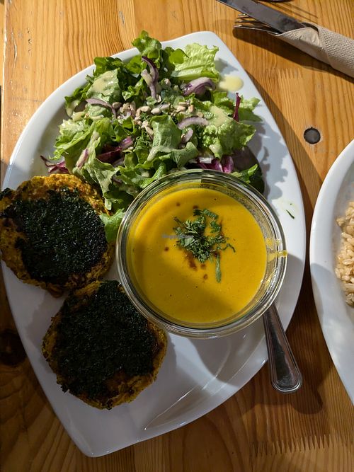 Combo menu of salad, soup, and vegetable rosti (in the shadow). at Cuit Lu Cru in Colmar