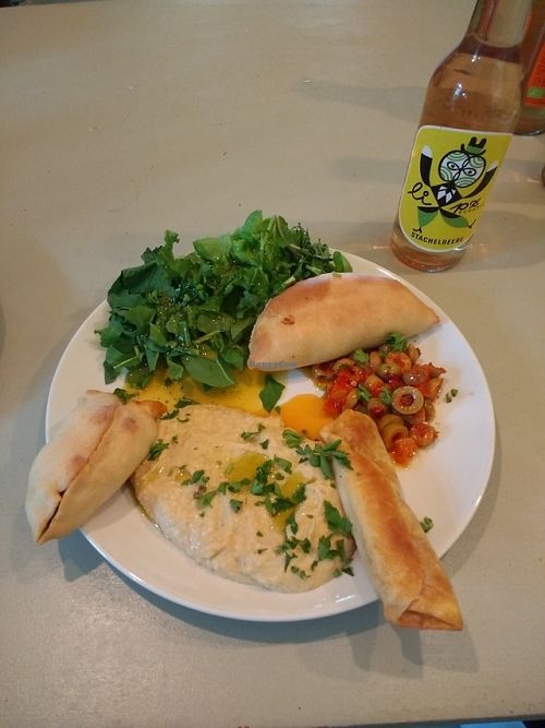 syrian filled dough, hummus, olives, salad at Superfood in Halle