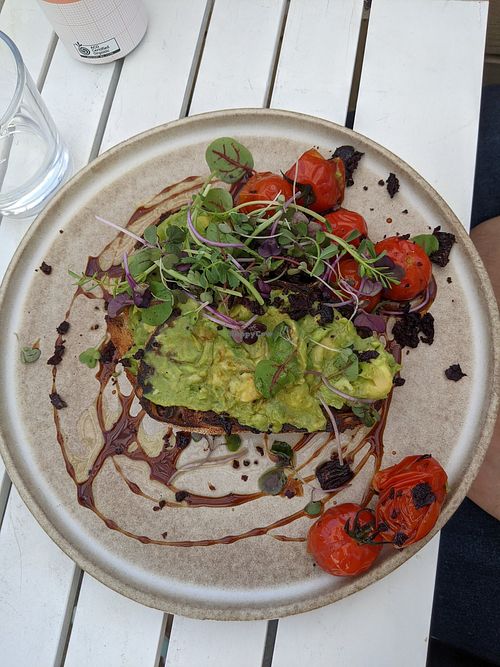 Roasted tomatoes with olive toast, avocado instead of eggs at Queenscliff General Store Cafe in Queenscliff