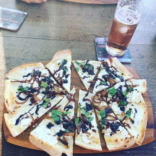 Goats cheese pizza with Caramelised onion, fresh basil and balsamic glaze  at The Hidden Veggie Kitchen in Limoges