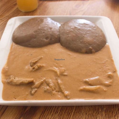 Sauce arachide avec seitan + télibor (pâté noir d’igname séchée)  at Loving Hut in Cotonou