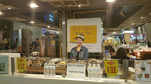 owner with food stall at Khun Ta J Food - Vegan Stall in Bangkok