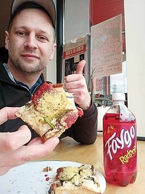 A slice ala carte with a red pop. at Pie-Sci in Detroit