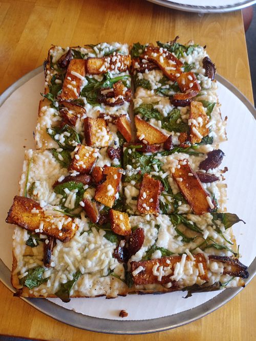 This white vegan pizza is amazing, but I still add the side of marinara. at Pie-Sci in Detroit