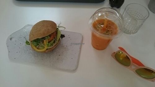 Gluten-free sorghum bun with chia, avocado and veggies and a smoothie with carrots and passionfruit  at Mommos Veranda in Kiruna