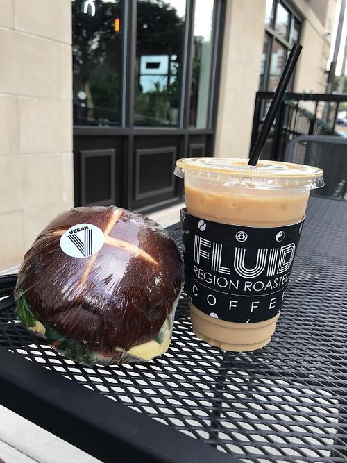 vegan seitan, cheese, lettuce and tomato sandwich with oat milk iced latte : ) at Fluid Coffeebar in Valparaiso