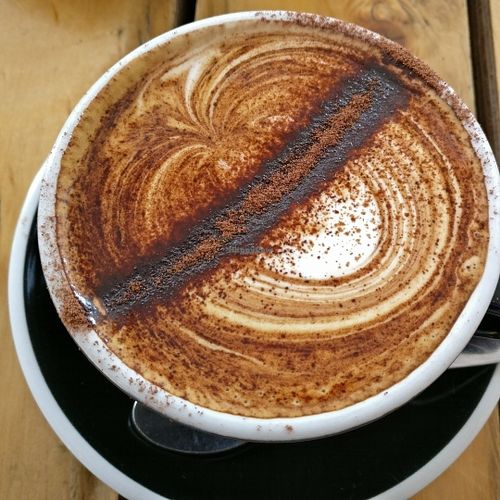 Great coffee - with a selection of mylks - this was macadamia nut.  at Particle Cafe in Avondale Heights