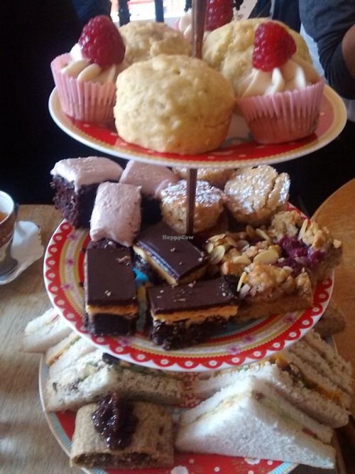Vegan afternoon tea tier of cakes and sandwiches at Hidden Lane Tea Room in Glasgow