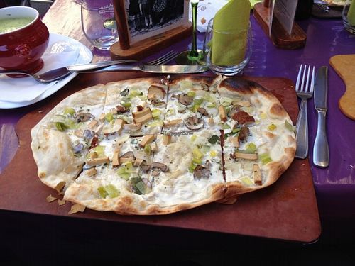 Vegan tarte flambée with soy cream, leek, mushrooms, and tofu. So good! at La soupe a Meme in Obernai