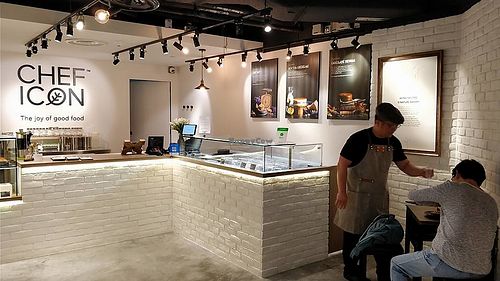 chef serving customer  at Chef Icon Nature Bakery - Katong in Central Singapore