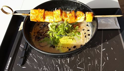 Vegan ramen soup topped with tofu and king oyster mushroom skewer at Miazaki in Tel Aviv